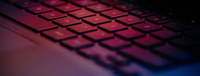 a-close-up-of-a-keyboard-with-a-blurry-background